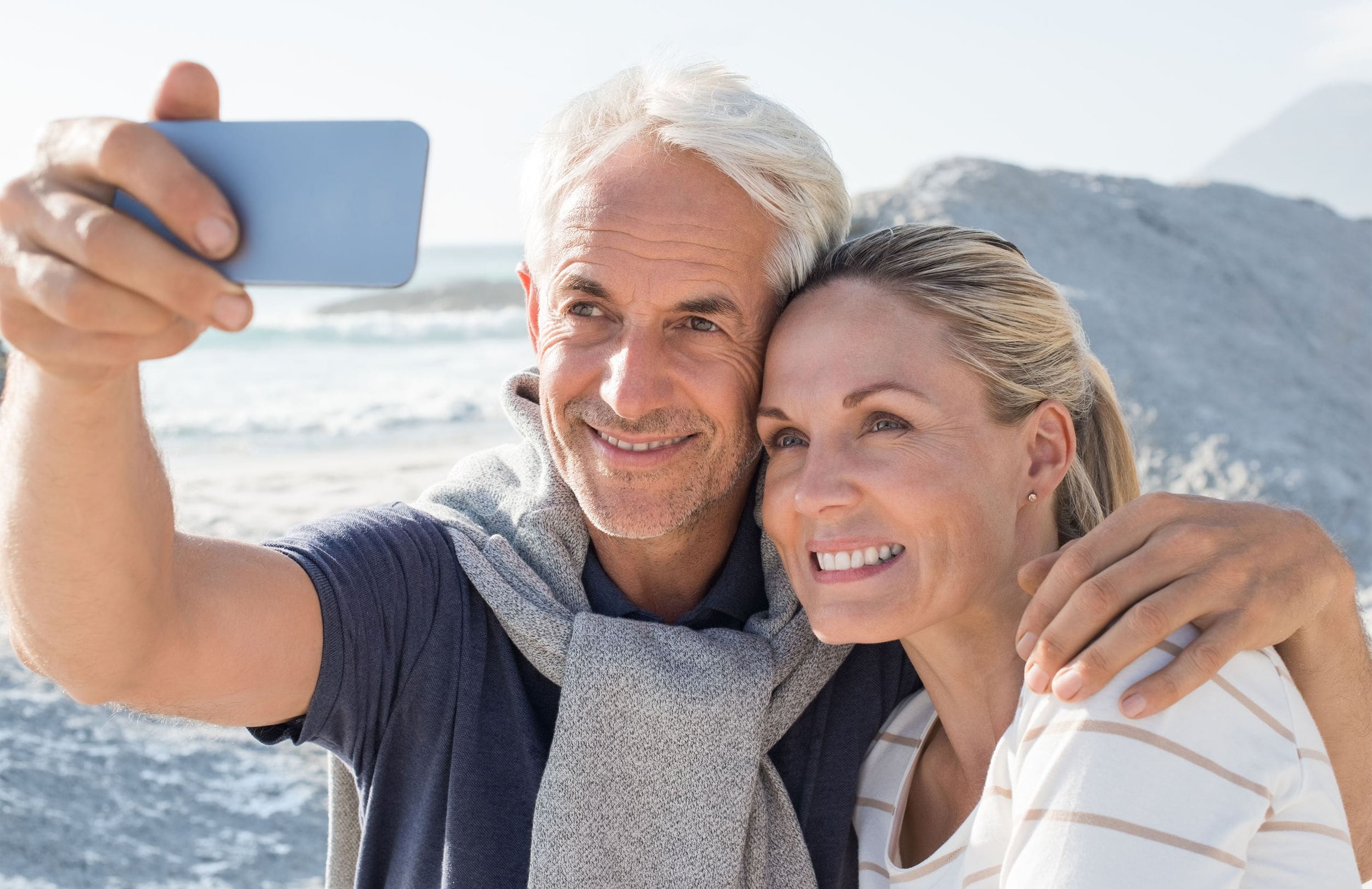 Mature couple taking a selfie while on vacation.