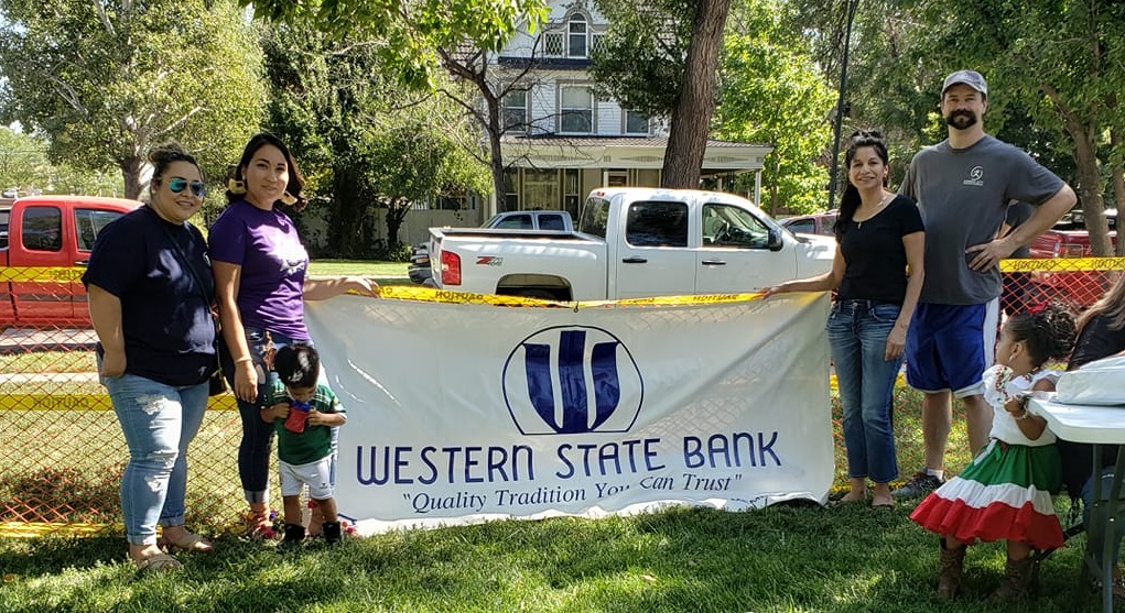 Garden City employees holding banner at Fiesta.