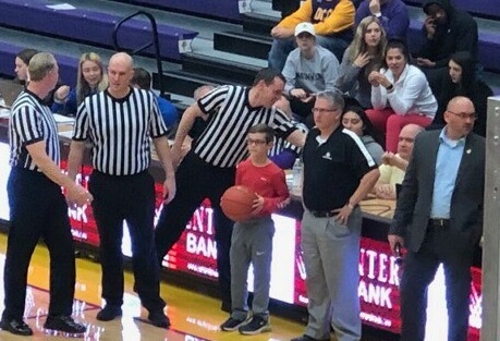 Todd English presenting game ball with his son