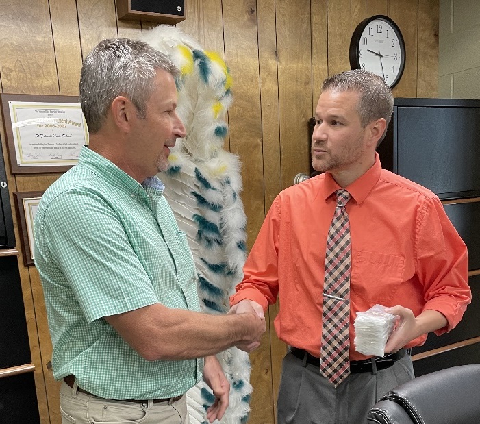 Banking Center President Troy Hilt with Superintendent Mark Penka