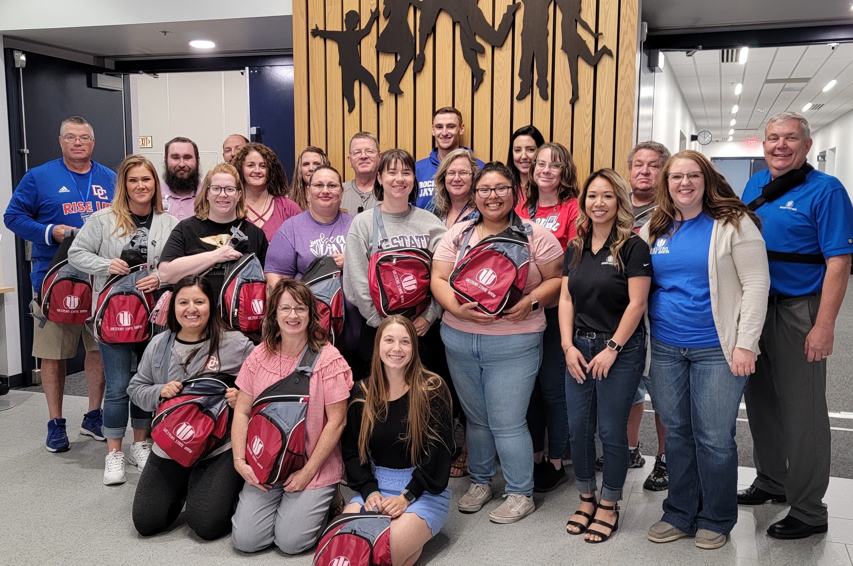 WSB staff posing with new teachers