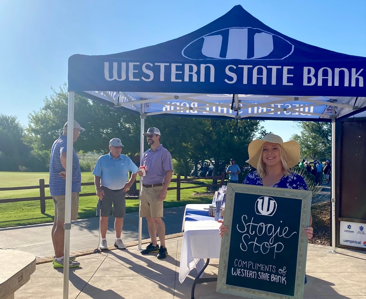wsb employees at golf tournament booth