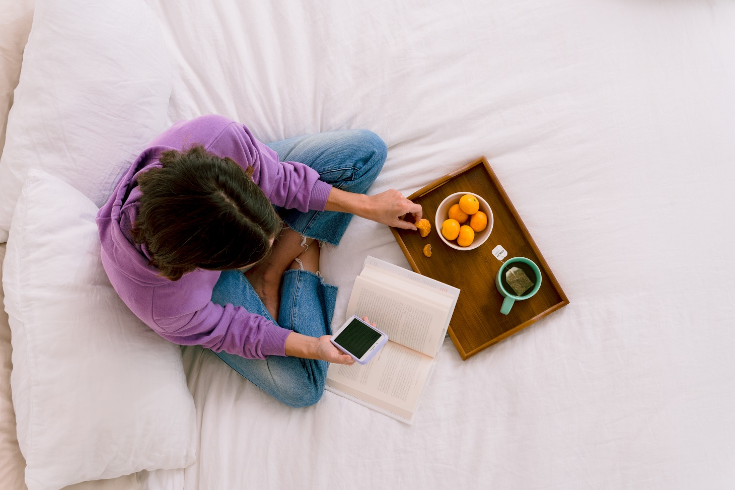 woman lounging looking at mobile phone zelle